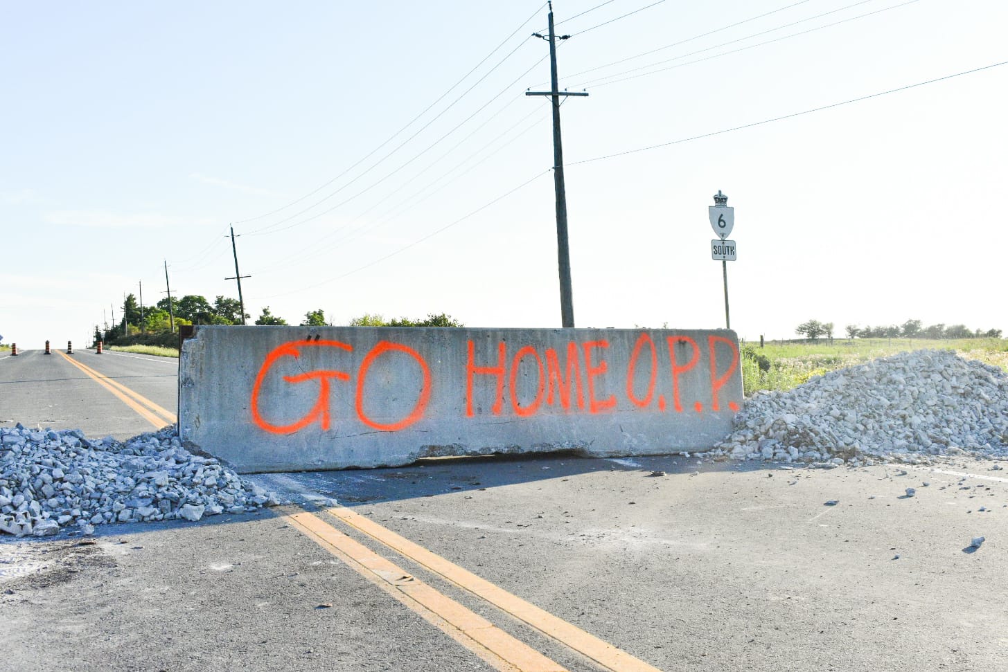 Barrier on road with grafitti