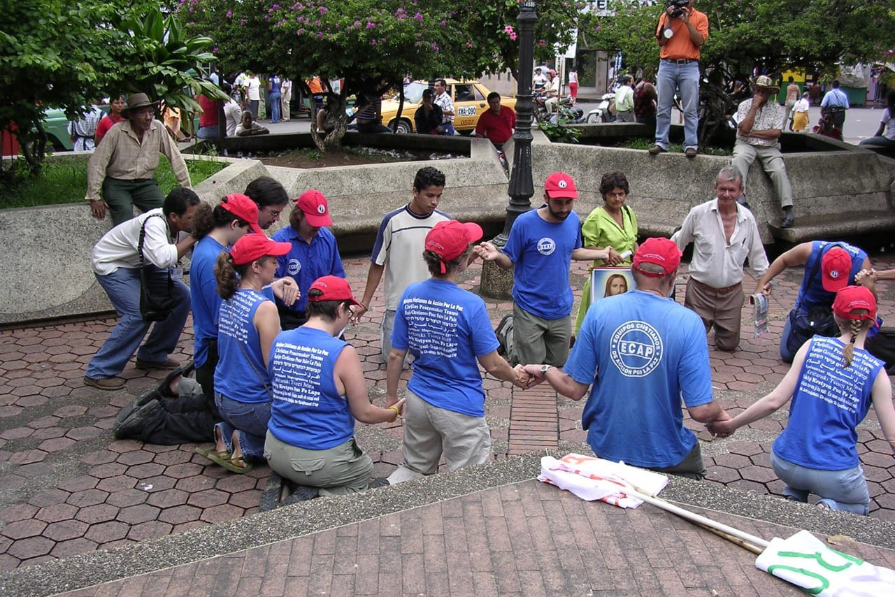 Colombia: In 2021, CPT - Colombia celebrated 20 years of groundwork supporting Colombian activists nonviolently resisting oppression. To mark this anniversary, the team have been sharing photos from the last two decades, including this one. Pictured are CPTers and delegates taking part in an action in Barrancabermeja.