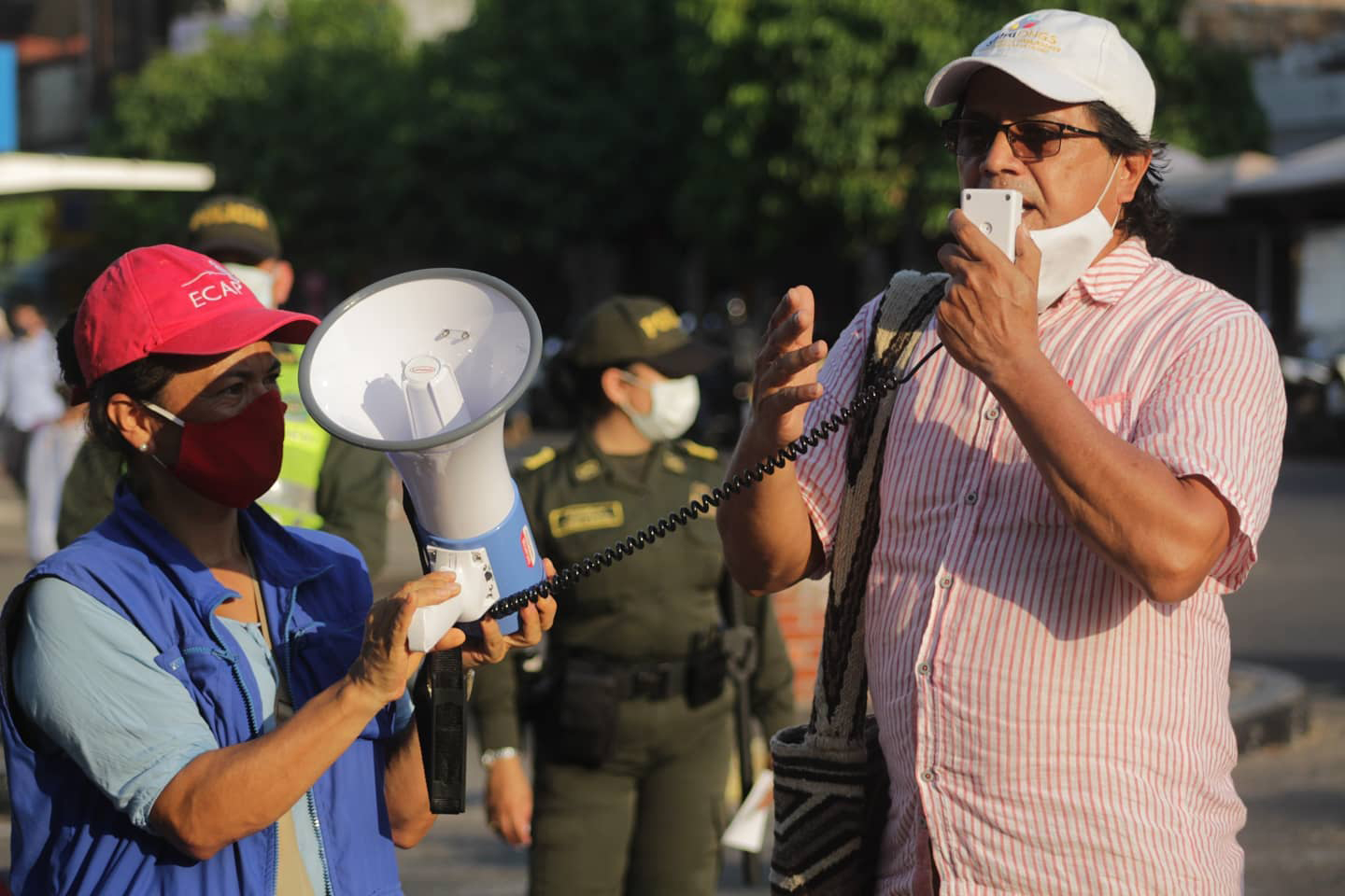 Colombia: In March, Colombians gathered to speak out against police and military brutality. Thousands of people took to the streets to denounce the disproportionate use of force by police and military forces, who systematically violate human rights. Our CPT Program Director, Milena Rincon, is pictured here, holding a microphone to help amplify the voice of Jairo Acevedo, Coordinator of the regional human rights forum, ESPACIO.