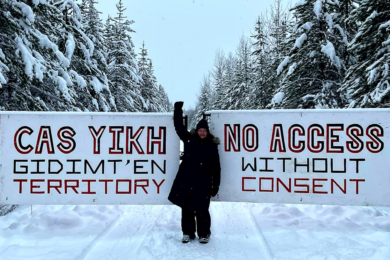Turtle Island Solidarity Network: CPT Canada Coordinator stands at the entrance to Coyote Camp in Wet’suwet’en Territory. CPT stands unequivocally with the Wet’suwet’en Land Defenders, and we demand CoastalGas Link and the RCMP get off the land.